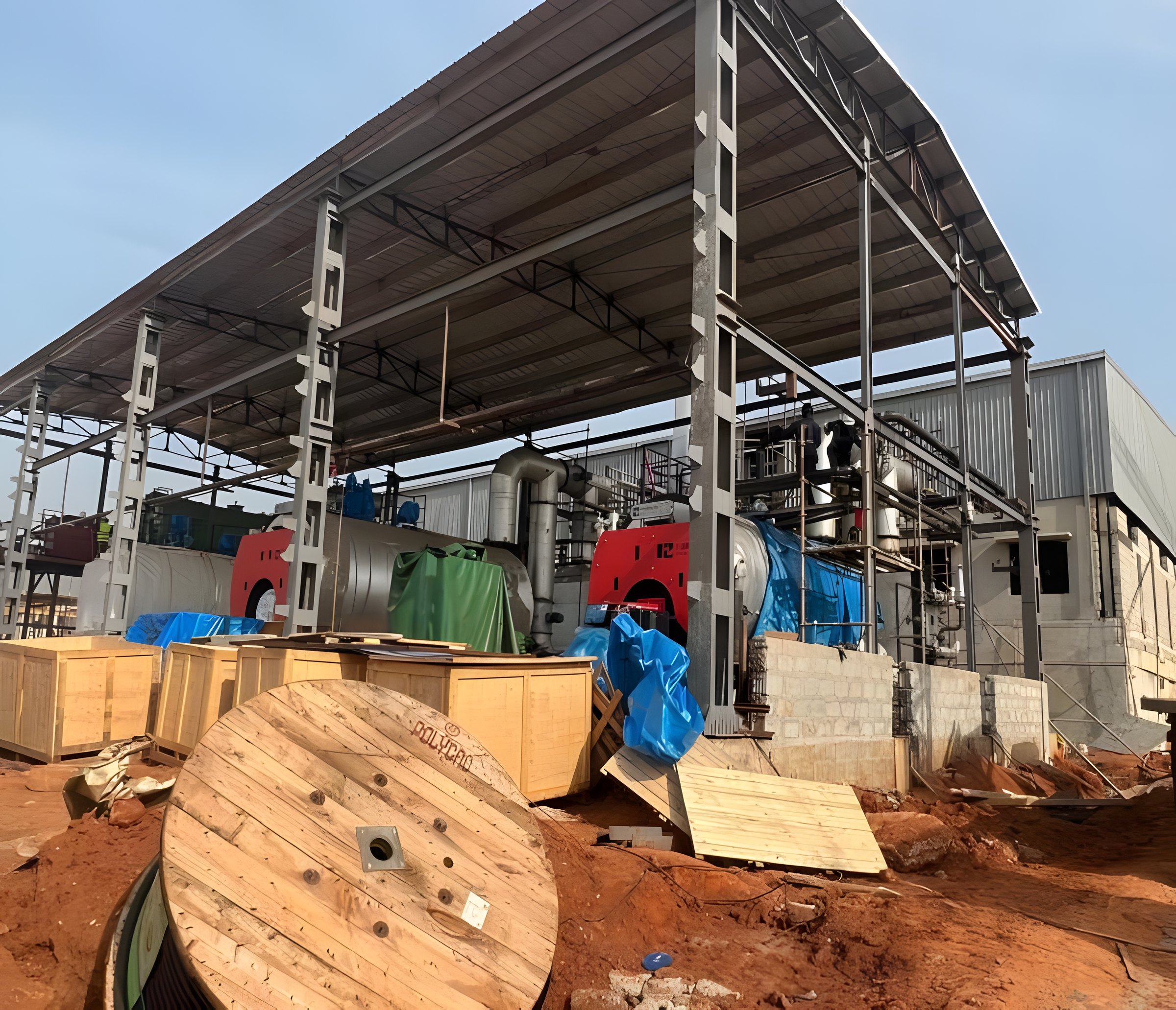 Industrial boiler cost includes the balance of plant, such as this boiler house under construction